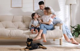 family sitting on sofa