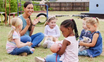 kids sitting on the grass