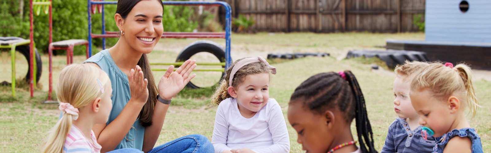 kids sitting on the grass